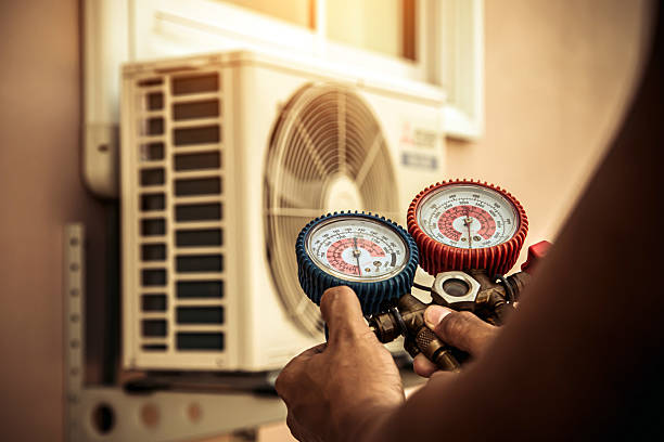 Professional Air Conditioning Service technician working in Boles, AR